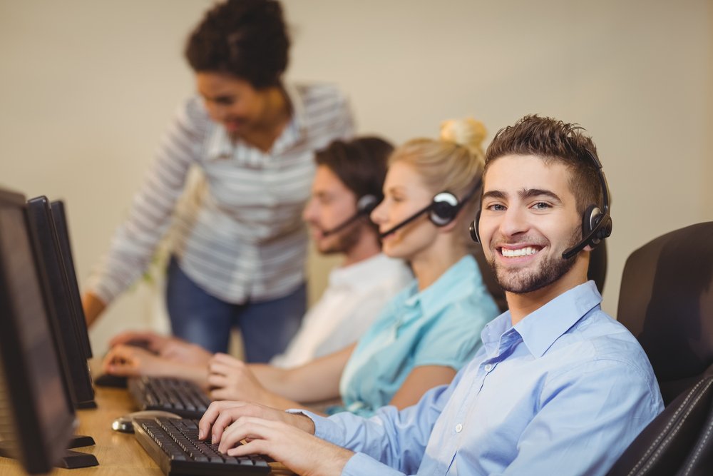 Happy employee in call center | employee experience